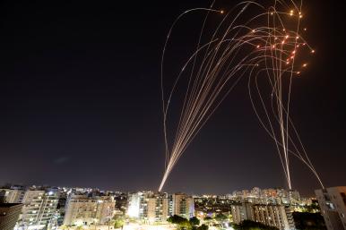 Photo showing the Iron Dome defense system intercepting Hamas rockets over Ashkelon, Israel, in May 2021.