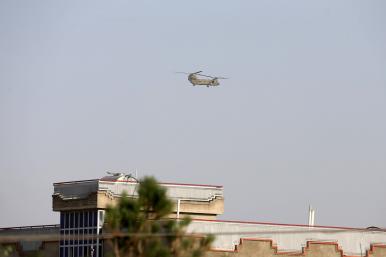 A U.S. military helicopter evacuates personnel from the American embassy in Kabul, Afghanistan