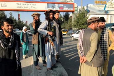 Photo showing Taliban fighters outside Kabul Airport, August 2021.