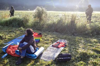 A Middle Eastern migrant with guards at the Belarus/Poland border. Source: Reuters