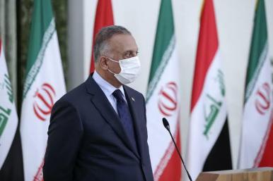 Kadhimi with Iranian and Iraqi flags