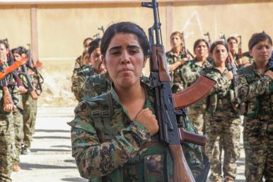 SDF fighters train at a US Army base in Syria