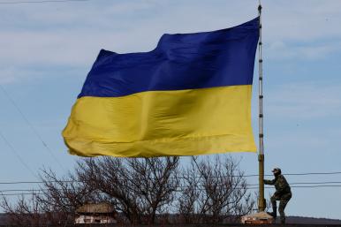 A Ukrainian flag flies at a naval base in Crimea in 2014 - source: Reuters
