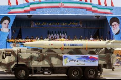 An Iranian Fateh-110 mobile missile launcher on parade