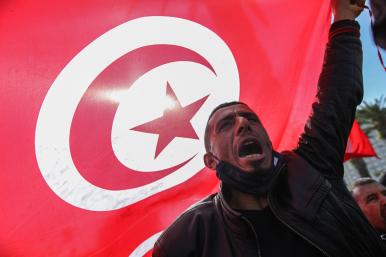 A supporter of Tunisia's Islamist Ennahda Party protests against the Tunisian president's 2022 coup - source: Reuters