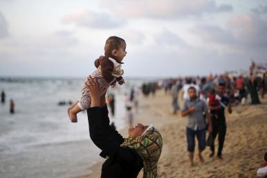 Palestians on a Mediterranean beach in Gaza