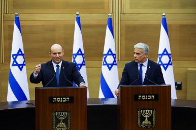 Photo of Israeli politicians Naftali Bennett and Yair Lapid delivering a statement..