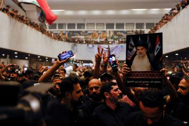 Supporters of Iraqi Shia cleric Moqtada al-Sadr gather during a sit-in, inside the parliament building in Baghdad - source: Reuters