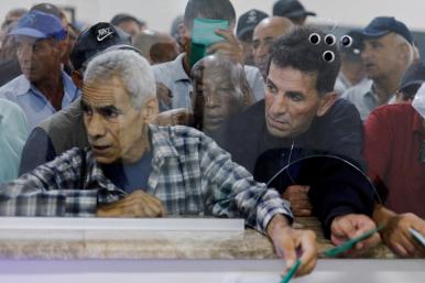 Photo of Palestinian workers awaiting entry into Israel from Gaza.