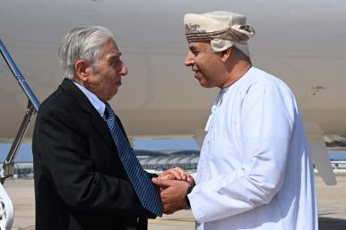 Baquer Namazi, a dual U.S.-Iranian citizen who had been imprisoned in Iran, shakes hands with an Omani official in Muscat - source: Reuters