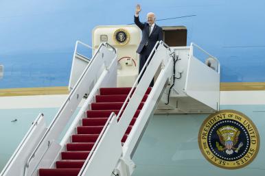 President Joe Biden waves from the steps of Air Force One - source: White House photo