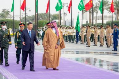 Crown Prince Muhammad and President Xi walking in Riyadh.