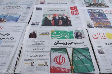 Newspapers at a shop in Tehran display headlines about the China-brokered Iran-Saudi deal in March 2023 - source: Reuters