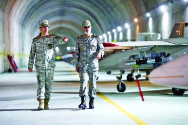 Iranian military officers, including Major General Bagheri, tour an underground air base - source: Iranian government