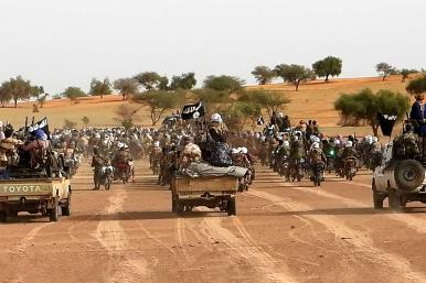 Islamic State forces, in convoy formation, declare allegiance to new caliph, 2023.