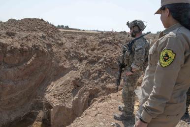 U.S. soldier and member of SDF