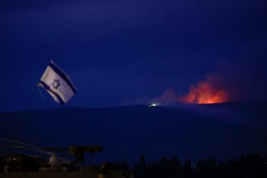 Photo showing flame and smoke rising over Lebanon's border with Israel.