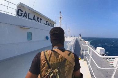 A Houthi fighter aboard the seized cargo vessel Galaxy Leader - source: Houthi media via Reuters