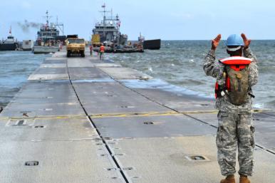 U.S. Army personnel prepare a temporary floating pier to deliver aid to Gaza - source: Department of Defense