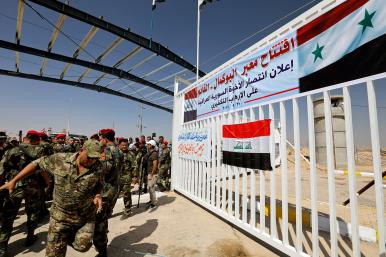 Security forces the Iraqi-Syrian border, after it has been reopened for trade and travel, in Al Qaim, Iraq in 2019 - source: Reuters