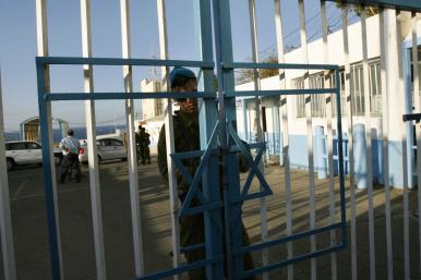 An Israeli border guard secures the gate at a crossing with Lebanon in 2007 - source: Reuters