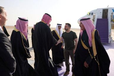 Photo showing Ukraine's President Zelensky greeting Saudi officials on the tarmac. 