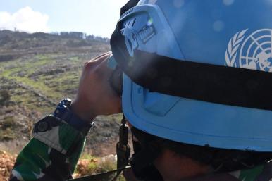 A United Nations peacepeeker scans the terrain in southern Lebanon - source: Untied Nations