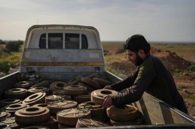 Photo of a Syrian soldier clearing landmines in Idlib province.