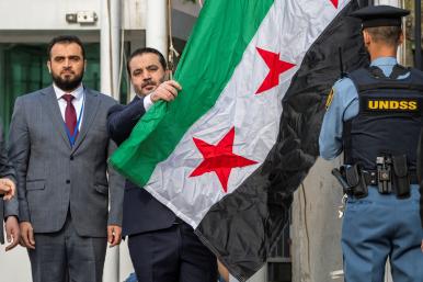 Syrian Foreign Minister Asaad Hassan al-Shibani attends the ceremony of the new Syrian government flag being raised for the first time, outside United Nations Headquarters in New York, U.S., April 25, 2025 - source: Reuters