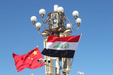 Chinese and Iraqi flags fly in Beijing during a state visit - source: Reuters