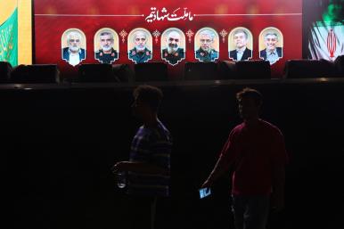 A sign in Tehran displays images of officials in Iran's nuclear program killed in Israeli airstrikes in June 2025 - source: Reuters