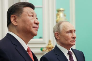 Close-up photo of Chinese leader Xi and Russian leader Putin.