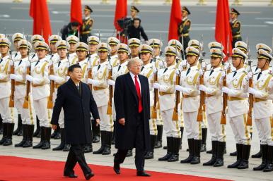 Chinese president Xi walks with U.S. president Trump in Beijing in 2017 - source: Reuters
