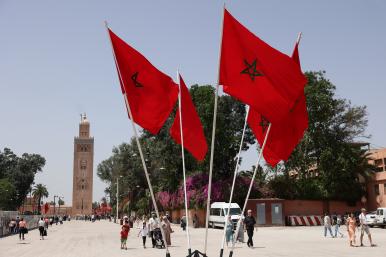 Moroccan flags fly in front of a mosque in Rabat - source: Reuters