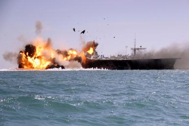 A tanker is destroyed as a test target during an Iranian naval exercise