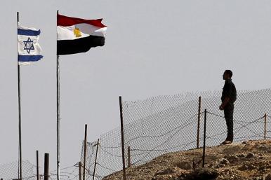 Egyptian and Israeli flags along the Sinai border