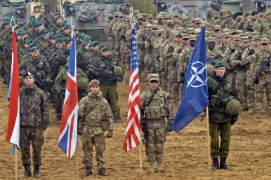 NATO solderis with alliance and national flags