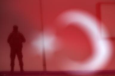 A Turkish soldier stands guard at a rally. Image source: Reuters