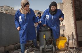 Women plumbers on rooftop