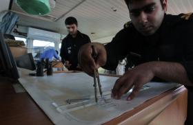 Iranian sailors on board a naval vessel in the Strait of Hormuz
