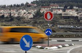 Traffic passes the Israeli settlement of Efrat in the West Bank