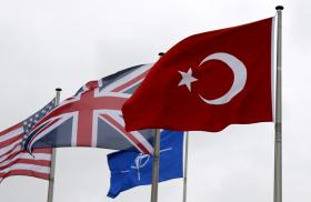 The flags of Turkey, the United States, United Kingdom, and NATO in Brussels