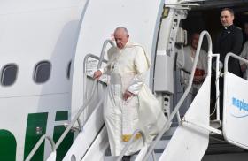 Pope Francis departs an airplane