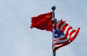 Chinese and U.S. flags flutter at a trade meeting in Shanghai