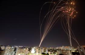 Photo showing the Iron Dome defense system intercepting Hamas rockets over Ashkelon, Israel, in May 2021.