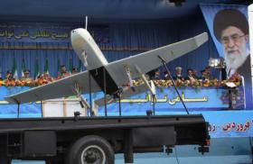 Photo of a Shahed drone in an Iranian military parade near imagery of Supreme Leader Khamenei..