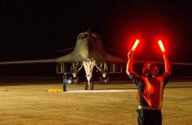 USAF ground crew directs a B-1 Lancer bomber