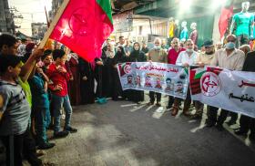 Palestinian protesters with PFLP flags