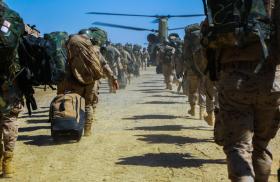 US Army troops board transport helicopters