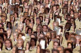 Portraits of Baha'i adherents arrested in Iran on display in Brazil - source: Reuters